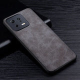 the back of a black leather case with a black leather cover