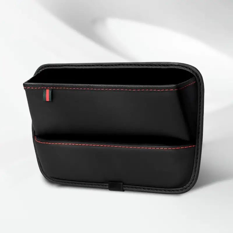 a black leather wallet with red stitching