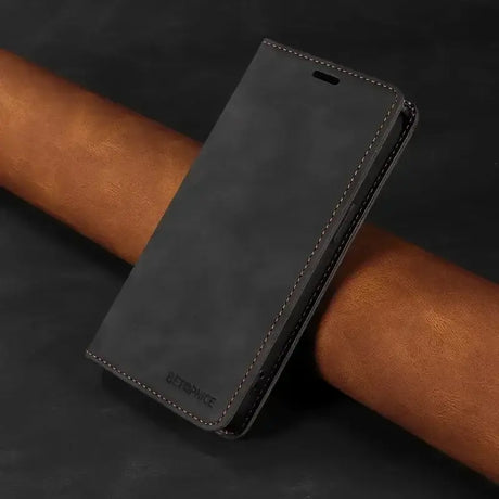 The back of a black leather iphone case