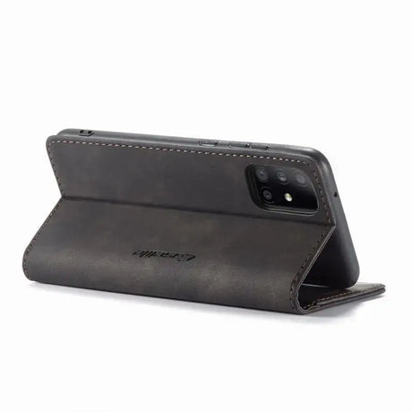 The back of a black leather iphone case