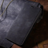 a black leather wallet case with chain