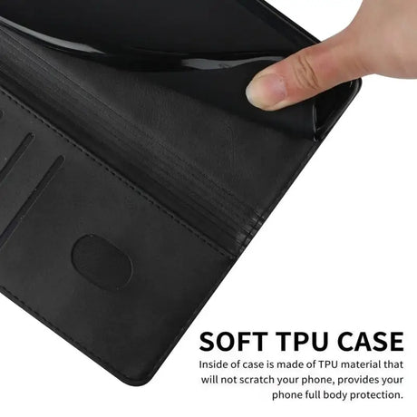 The black leather wallet case is open and showing the card slot