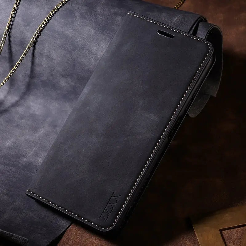 a black leather wallet case with chain