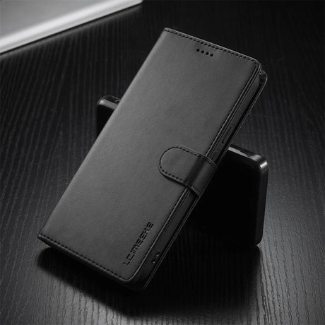 Black leather wallet-style phone case with a magnetic clasp.