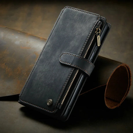 Black leather wallet with a zipper compartment and snap closure.