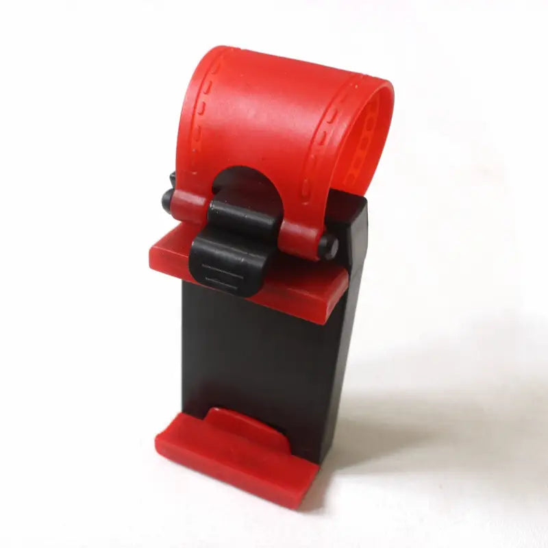 a red and black lego toy on a white background