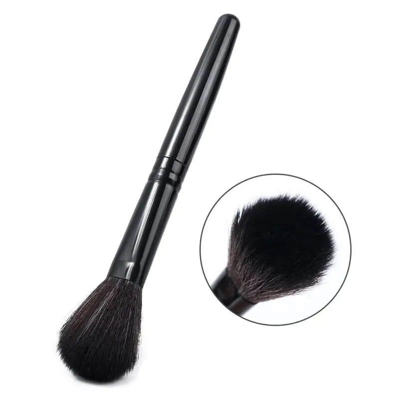 the black makeup brush with a black handle