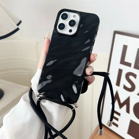 Black marble-patterned phone case with lanyard.
