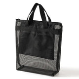 a black mesh bag with a black handle