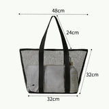 a black mesh tote bag with a zipper closure
