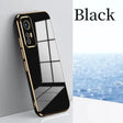 a black and gold iphone case on a white surface