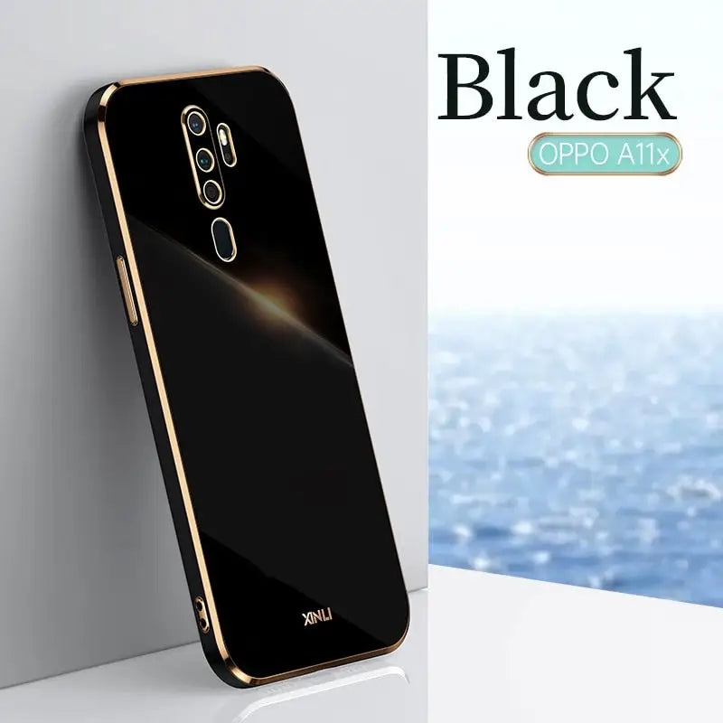 the back of a black op phone with a gold frame
