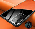 the back of a black and orange case with a phone in it