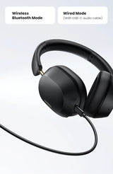 Black over-ear headphones with both wireless and wired connectivity options.