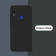 A black phone with a blue button on the back of it