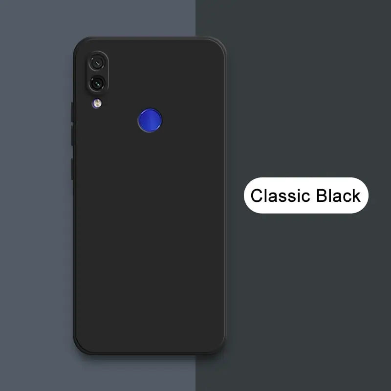 a black phone with a blue button on the back of it