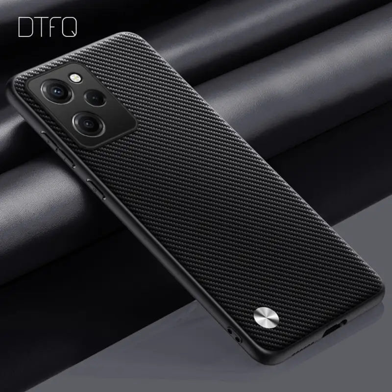 the back of a black phone case with a carbon fiber texture