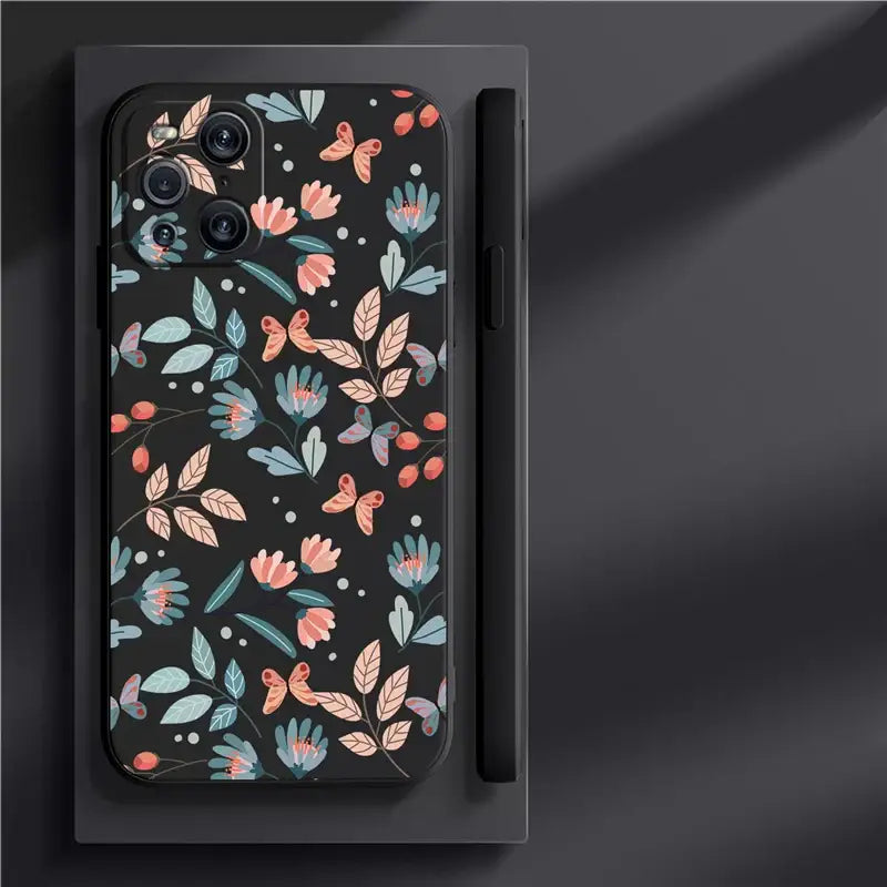 a black phone case with a floral pattern