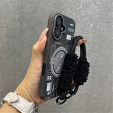 Black phone case with fuzzy strap.