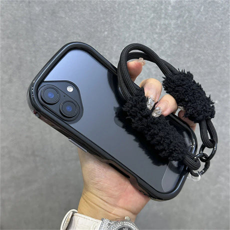 Black phone case with fuzzy strap.