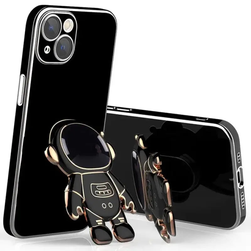 a black phone case with a gold robot