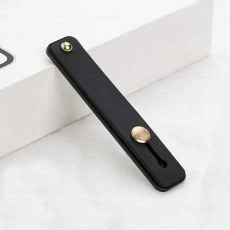 A black phone case with a gold button