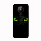 a black phone case with a green eyes and a black background
