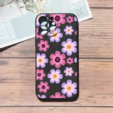 A black phone case with pink and purple flowers