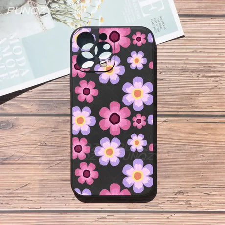 A black phone case with pink and purple flowers