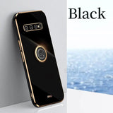 the back of a black phone with a gold ring