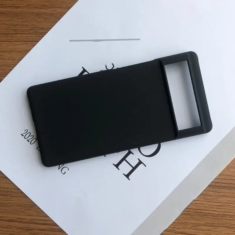 a black phone case sitting on top of a white box
