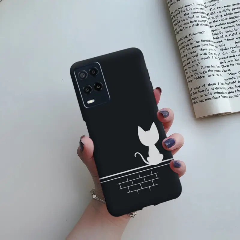 a black cat phone case with a white cat on it