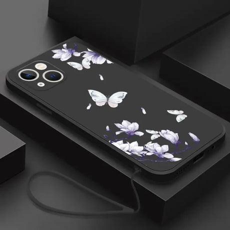 A black phone case with white flowers on it