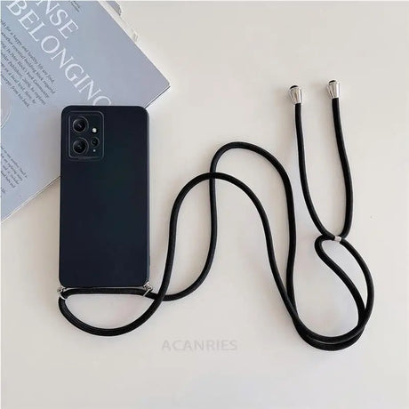 A black phone with a black cord attached to it