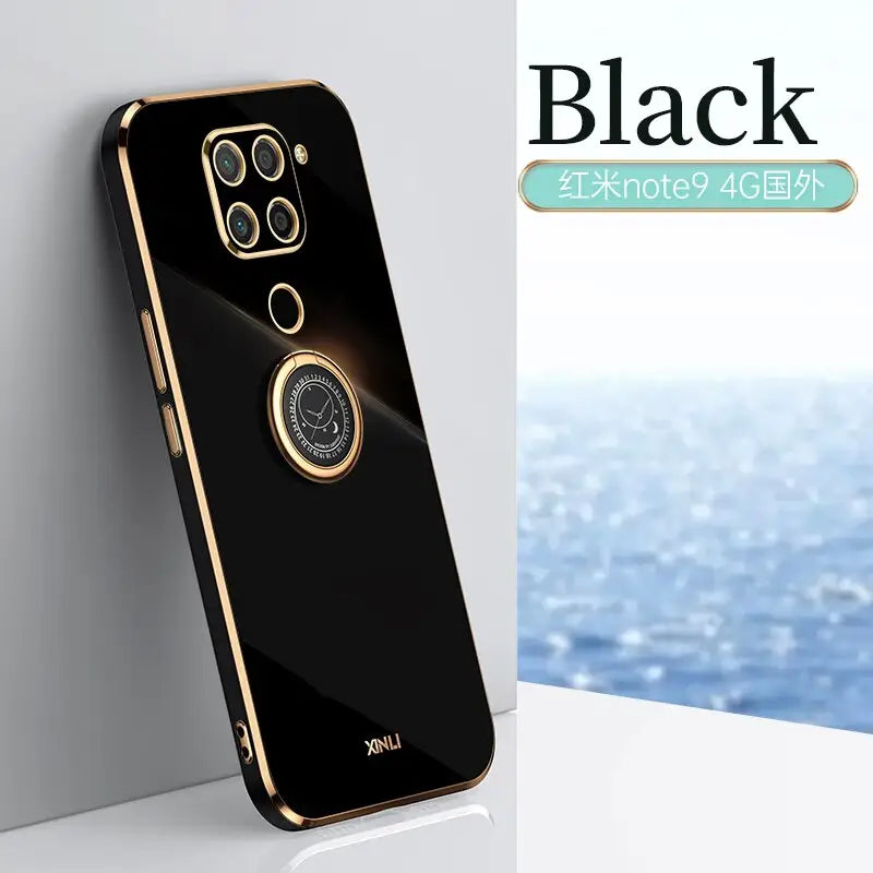 the back of a black phone with a gold ring