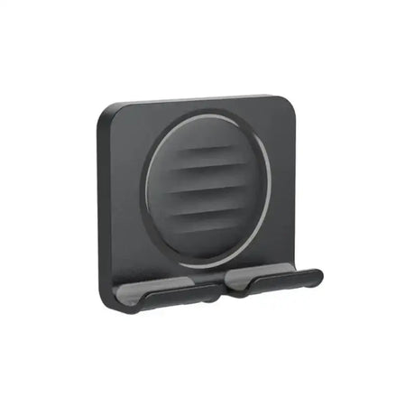 the black phone holder is attached to a white background