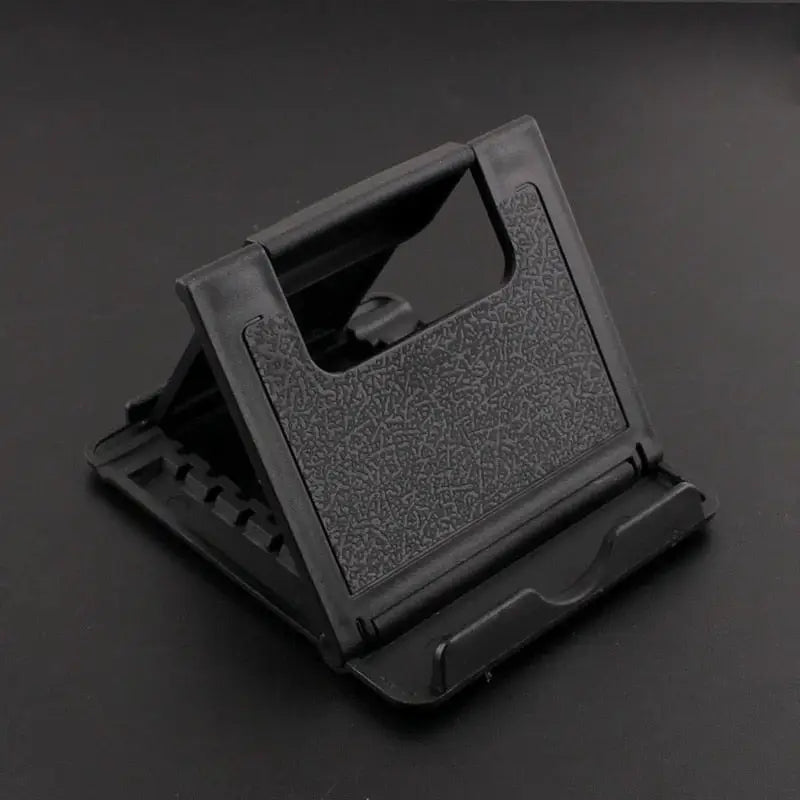 a black phone holder on a black table