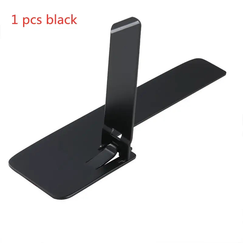 a black phone stand with a white background