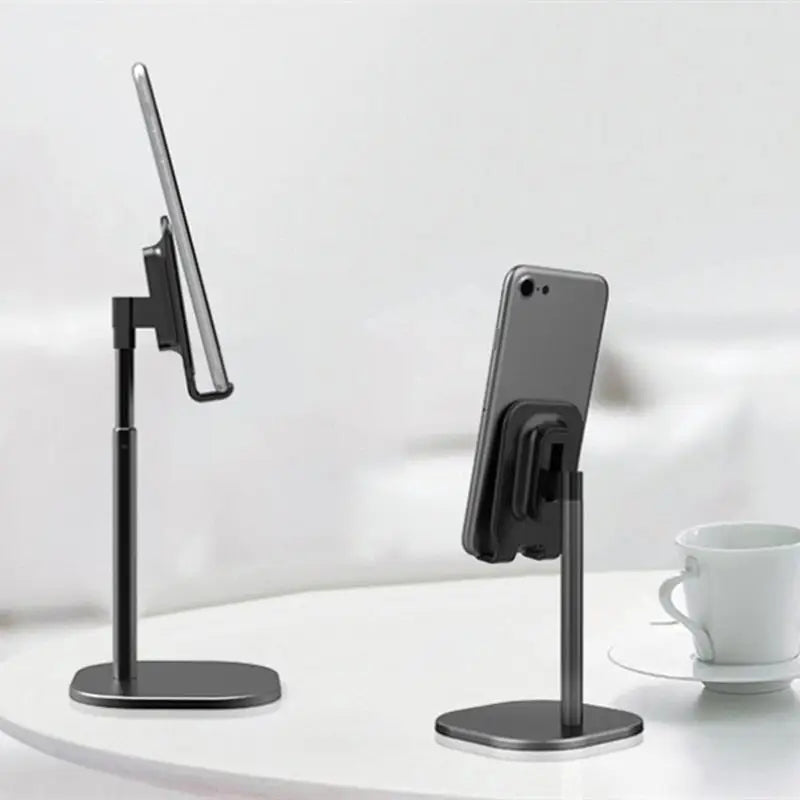 a black phone stand on a white table