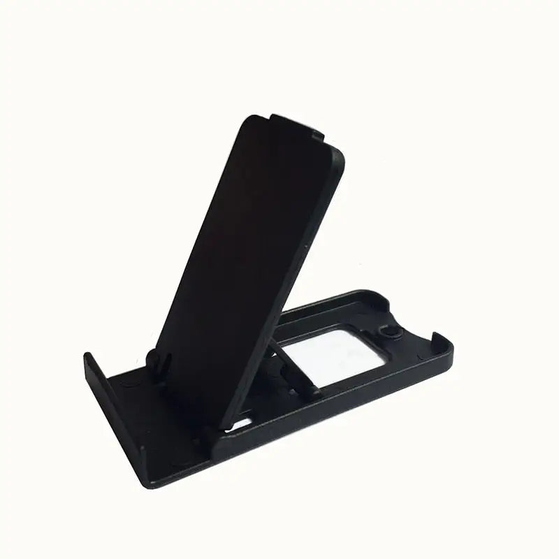 a black phone stand with a white background