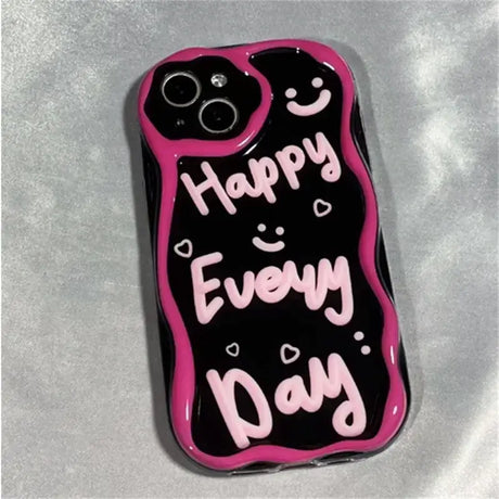 A black and pink phone case with the words happy day