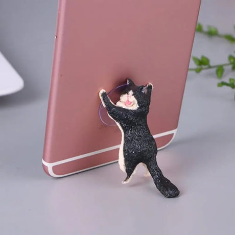 a cat phone holder with a cat on it