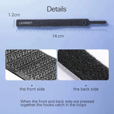 a black plastic brush with a ruler and a ruler