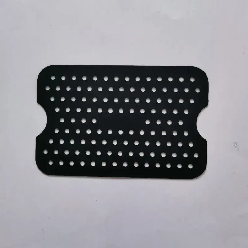 a black plastic plate with holes