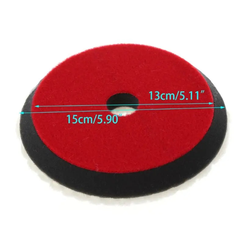 a red and black polish pad with a white background