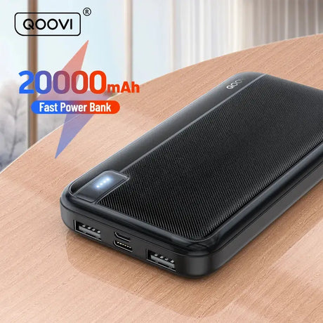 a black power bank on a wooden table