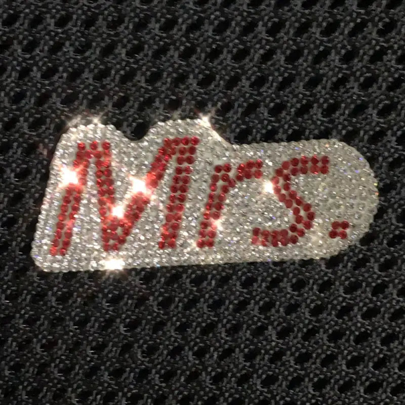 a black bag with a red miss logo on it