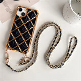 Black quilted phone case with gold chain strap.