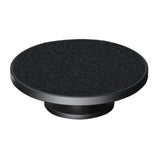 a black round knob with a black surface