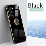 the back of a black samsung phone case with a gold ring